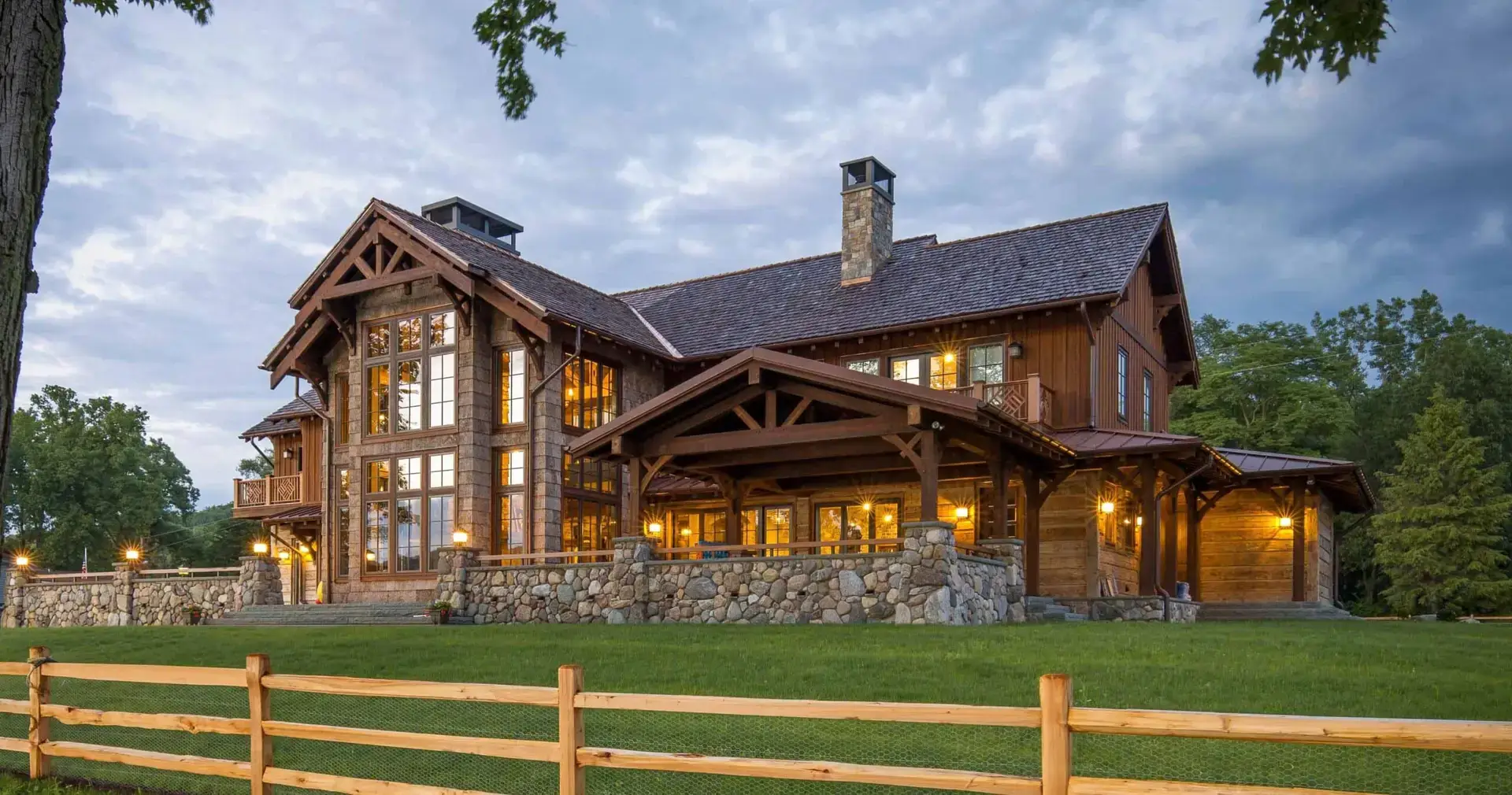 Timber frame home with stone chimney